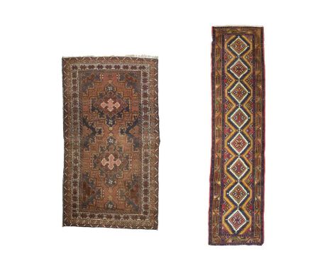A woolen runner and a woolen rug. The multicoloured runner with eight central medallions, 76cm x 305cm. The rug with two meda