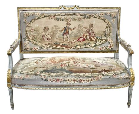 A French Louis XVI style salon settee. Circa 1900, with original Aubusson style tapestry upholstery and grey painted and gilt