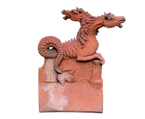 A terracotta 'Janus Horse' ridge tile. Modelled as a double headed horse with stylised serpent's tail. Height 52cm, width 43c