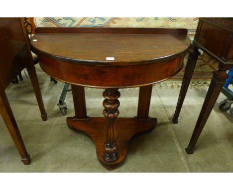 A Victorian mahogany demi-lune console table