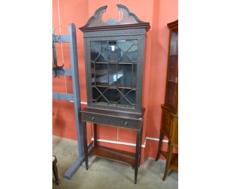 An Edward VII Chippendale Revival mahogany cabinet on stand