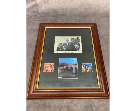 A framed signed photograph of the Rolling Stones including the late Brian Jones    Frame size 32 x 38cm