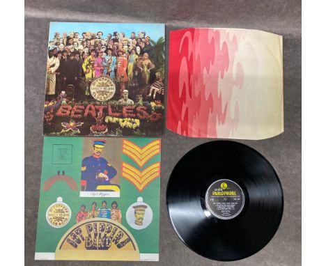 Sgt Pepper PMC 7027 Sleeve near mint, Vinyl near mint     Mono 67 first pressing. KT Tax code stamp Fools inner sleeve Extra 