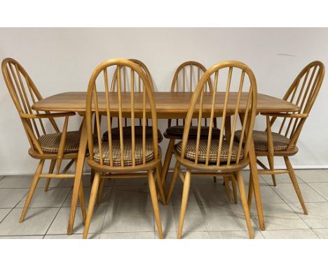 A mid century Ercol table and 6 dining chairs