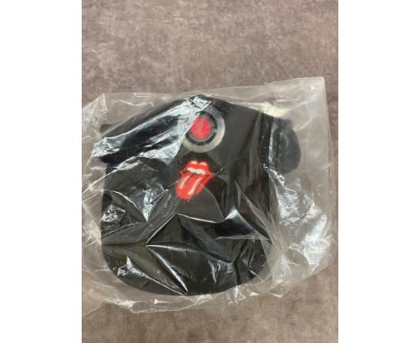 A Rolling Stones crew cap with built in head torch, still sealed in original bag