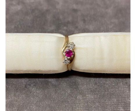 A 9 carat gold ladies ring set with illusion diamonds and ruby, size R total weight 2 grams