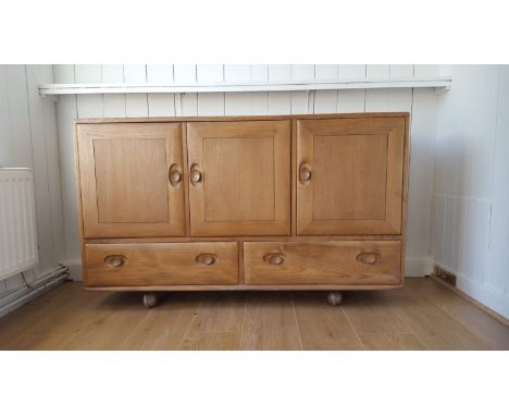 A mid century Ercol blonde Windsor side board