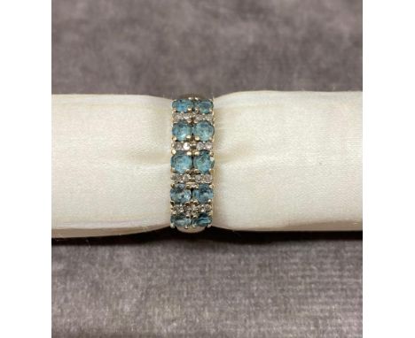 A 9 carat gold ladies ring set with diamonds and blue stones size R, 3.2 grams