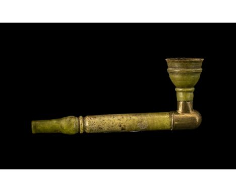 Chinese Antique Green Jade Opium Pipe of Traditional Shape, the bowl supported by a brass mount.  7" length, 3" height.
