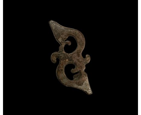 2nd-3rd century AD. A tinned bronze plate brooch formed as two La Tène trumpet motifs with scrolled detailing; hinge and catc