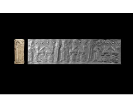 14th century BC. A composition cylinder seal with frieze comprising two recumbent winged gryphons back to back, to running sc