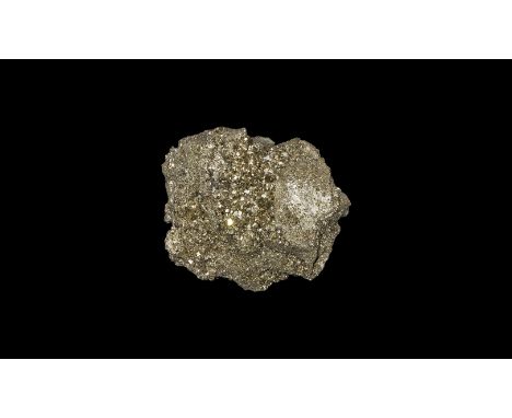 . A massive boulder of pyrite crystals ranging in size from minute to larger formations, deeply striated and with a bright lu
