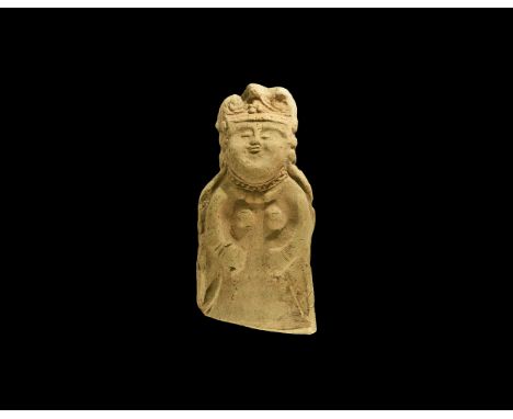 Kiddinite Period, 4th-5th century AD. A flat ceramic plaque formed as a female dressed in a long dress, wearing a crown or a 