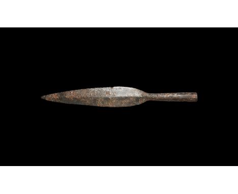 2nd-1st century BC. A broad leaf-shaped iron blade, lentoid in section with short neck, tubular closed socket with opposed ho