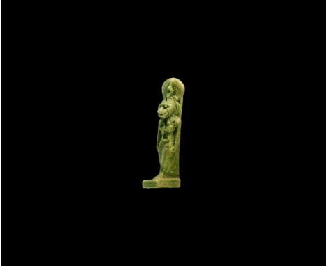 Saite Period, 624-525 BC. A green glazed composition amulet of Sekhmet wearing a sun-disc headdress with uraeus, base and dor