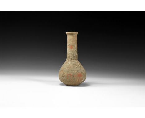 1st-2nd century AD. A ceramic vase with flat rim, long tapering neck and globular body with flat base.  160 grams, 14cm (5 1/