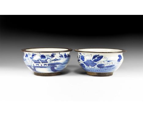 19th century AD. A pair of ceramic glazed bowls with basal ring and flared rim with meander pattern; blue floral design to on