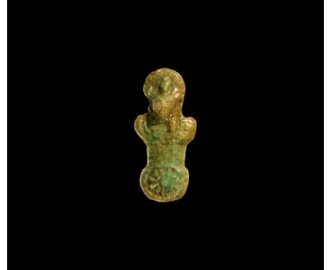 Third Intermediate Period, 1069-702 BC. A green-olive glazed composition amuletic aegis with counterpoise, lion's head with d