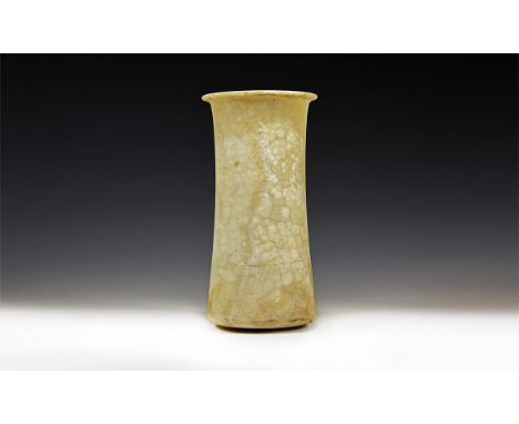 2nd millennium BC. A tall alabaster vessel with tapering profile and flared rim, rounded base.  2.3 kg, 24.5cm (9 1/2"). Prop