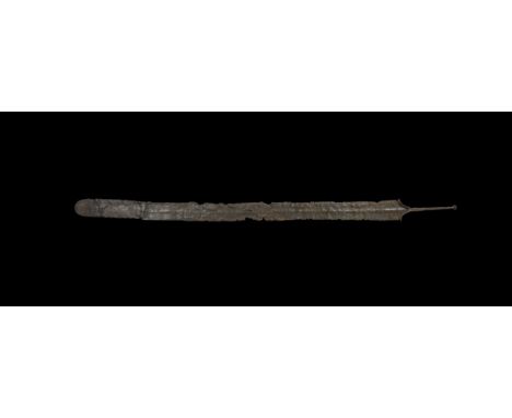 2nd century BC-1st century AD. An iron spatha-type sword with rounded tip, shallow midrib, scooped shoulders with campanulate