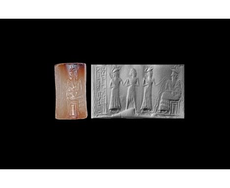 23rd-22nd century BC. A mottled chalcedony cylinder seal with judgement scene; the water-god Enki seated confronts a human fl