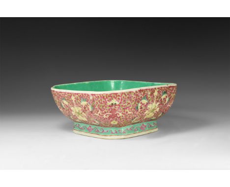 19th century AD. A ceramic footed bowl, square with fluted corners, green inner face and outer dense design of pink tendril a