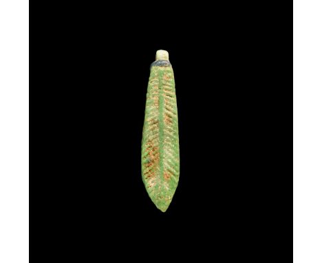 18th Dynasty, 1550-1292 BC. A green glazed composition date palm leaf amulet with applied loop. Cf. Andrews, C. Amulets of An
