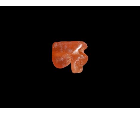 Late Period, 664-332 BC. A carnelian wedjat amulet pierced transversely. Cf. Flinders Petrie, W.M. Amulets illustrated by the