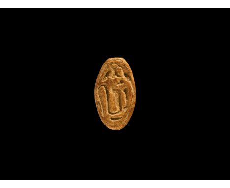 18th Dynasty, 1550-1292 BC. A grey glazed composition plano-convex scarab with hieroglyphs to the underside. Cf. Flinders Pet