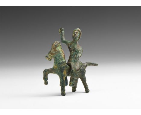 1st century BC-1st century AD. A bronze figurine comprising a horse with one raised foreleg, extended tail, collar to the nec