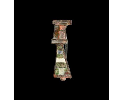 1st-2nd century AD. A bronze hinge-headed enamelled brooch with shallow bow and trapezoidal footplate with panels of enamel o