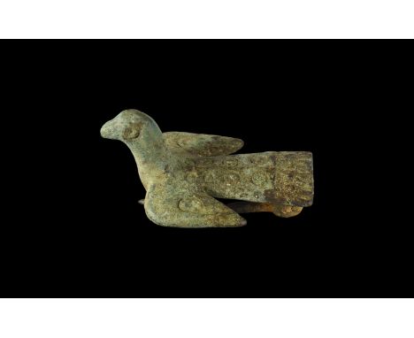 2nd century AD. A bronze bird plate brooch with head and neck modelled in the round, notched trailing edges to the wings and 