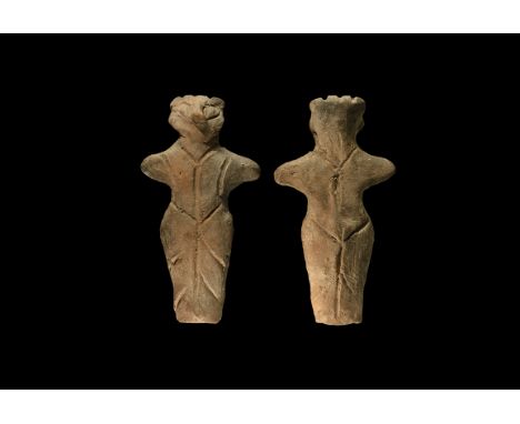 Neolithic, 6th-4th millennium BC. A ceramic figurine of a standing female with prominent nose, arms extended, incised detail 