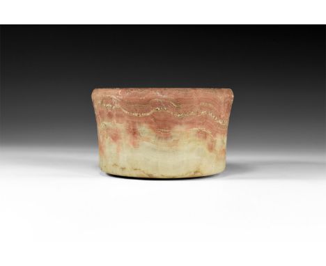 2nd millennium BC. A carved stone bowl with slightly flared body and chamfered rim.  923 grams, 13.5cm (5 1/4"). Property of 