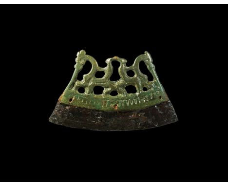 10th-11th century AD. An iron fire steel with a bronze openwork handle, formed as a pair of horses and riders facing outwards
