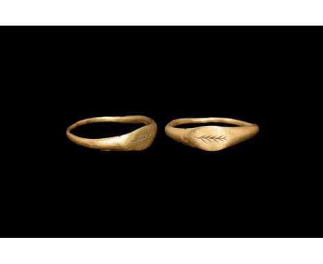 1st century AD. A slander gold ring with elliptical plaque, incised palm frond to the bezel. Cf. Ruseva-Slokoska, L. Roman Je