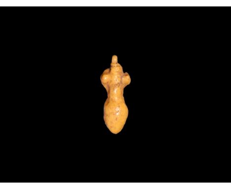 New Kingdom, 1550-1070 BC. A yellow glazed composition amulet of sma, the symbol for unification. Cf. Andrews, C. Amulets of 