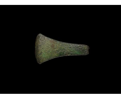 22nd-19th century BC. A Migdale Type straight-sided flat axe with thin curved butt, facet to the blade with slightly convex c