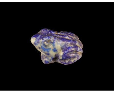 New Kingdom, 1550-1070 BC. A carved lapis lazuli amulet of a squatting frog, pierced laterally. Cf. Andrews, C. Amulets of An