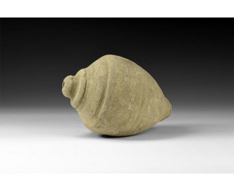 9th-11th century AD. A hollow-formed piriform ceramic vessel with low rim to the mouth, incised tiers to the shoulder. See Ar