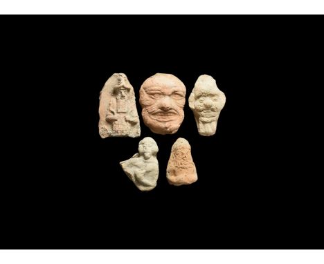 19th-3rd century BC. A group of ceramic plaques and figures comprising of: a tongue-shaped plaque with a high relief of a bea