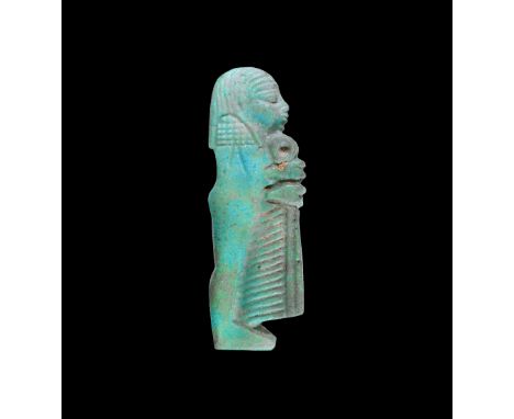 Late Period, 664-332 BC. A pale blue glazed composition plano-convex amuletic plaque of Duamutef standing with sceptre; holes
