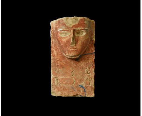 2nd century BC-2nd century AD. A carved limestone stele, rectangular and flat in section with high-relief facial details incl