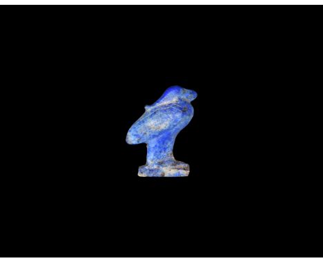 First Intermediate Period, 2181–2055 BC. A carved lapis lazuli amulet of a bird standing on a rectangular base, hatched detai