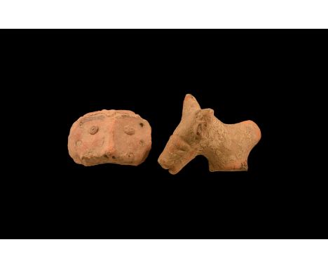 Archaic Period, 8th-5th century BC. A pair of ceramic figurines consisting of: a bull's head with hump to the back and short 