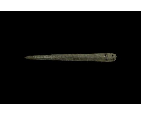 12th-8th century BC. A Late Bronze Age narrow bronze dagger, lozengiform in section with acute tip; to the shoulders, four ho