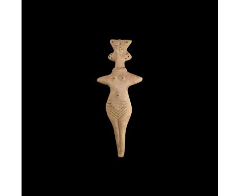 12th-7th century BC. A ceramic female figure with elaborate headdress, pinched facial features, applied necklace band, arms e