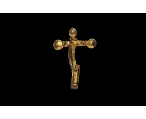 3rd-4th century AD. A gilt-bronze crossbow brooch with facetted crossbar, three facetted knops with ribbed collars, shallow b