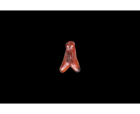 New Kingdom, 1550-1070 BC. A carved carnelian amuletic pendant of a fly, pierced at the head. Cf. Andrews, C. Amulets of Anci