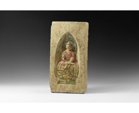 Northern Wei Dynasty, 386-534 AD. A ceramic brick with recess to one face, figure of Buddha nimbate and with one hand raised,